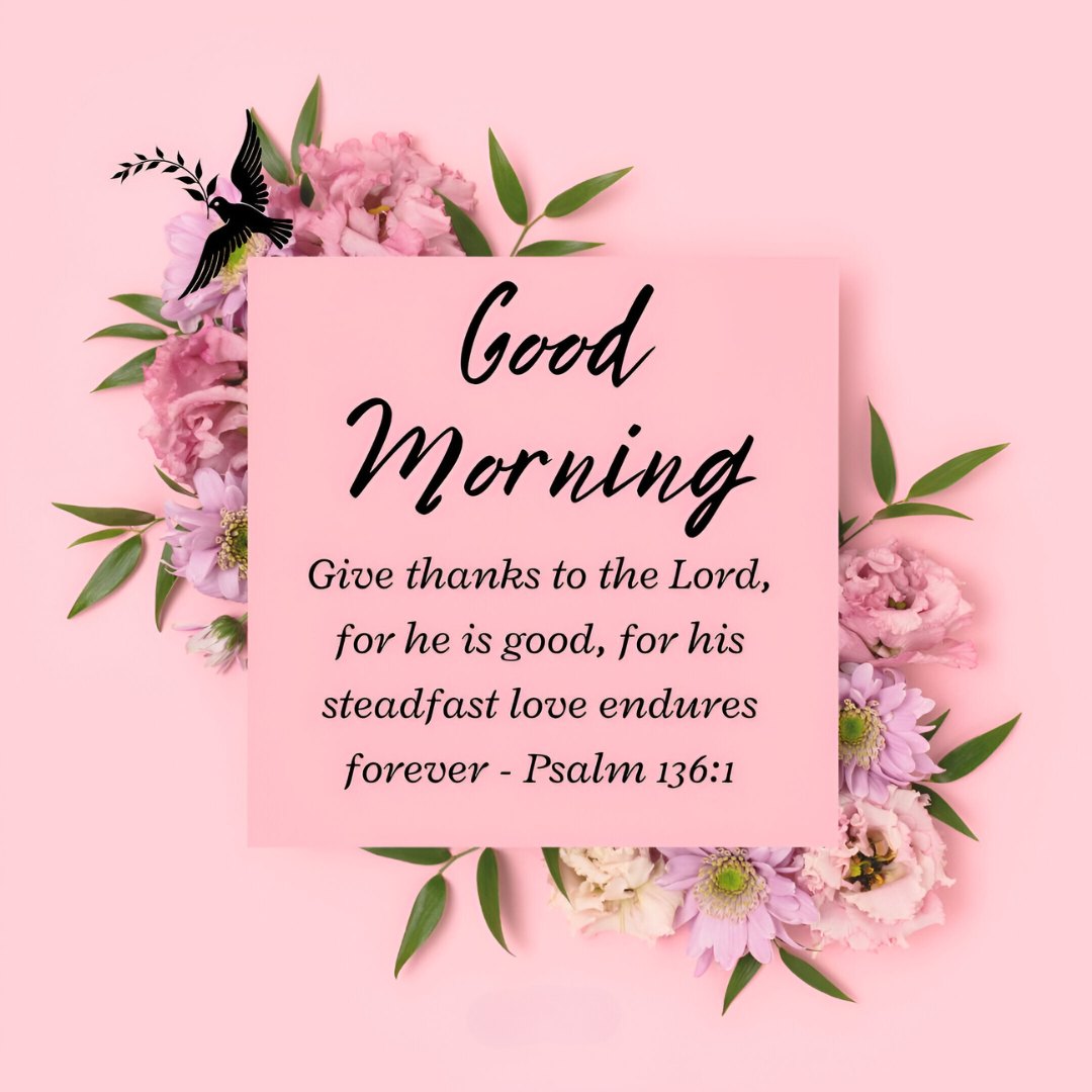 Good Morning message with Psalm 136:1 on a pink background, surrounded by a beautiful arrangement of pink flowers and greenery, embodying Good Morning Bible Verses for Gratitude and Joy.