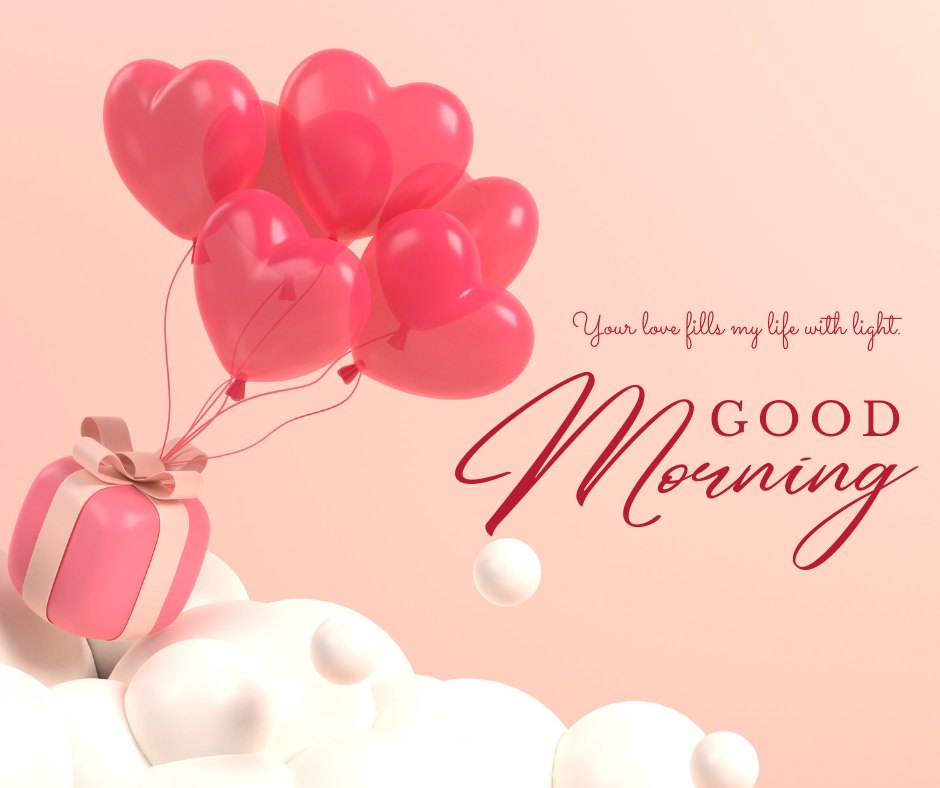 Good morning heart image with a cluster of pink heart-shaped balloons tied to a pink and white striped gift box, floating above fluffy white clouds, accompanied by the text 'Good Morning' and the quote 'Your love fills my life with light.'