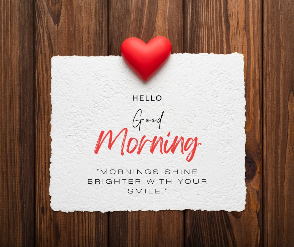 Good morning heart image with a red heart on textured white paper against a wooden background, featuring the greeting 'Hello Good Morning' and the quote 'Mornings shine brighter with your smile.'