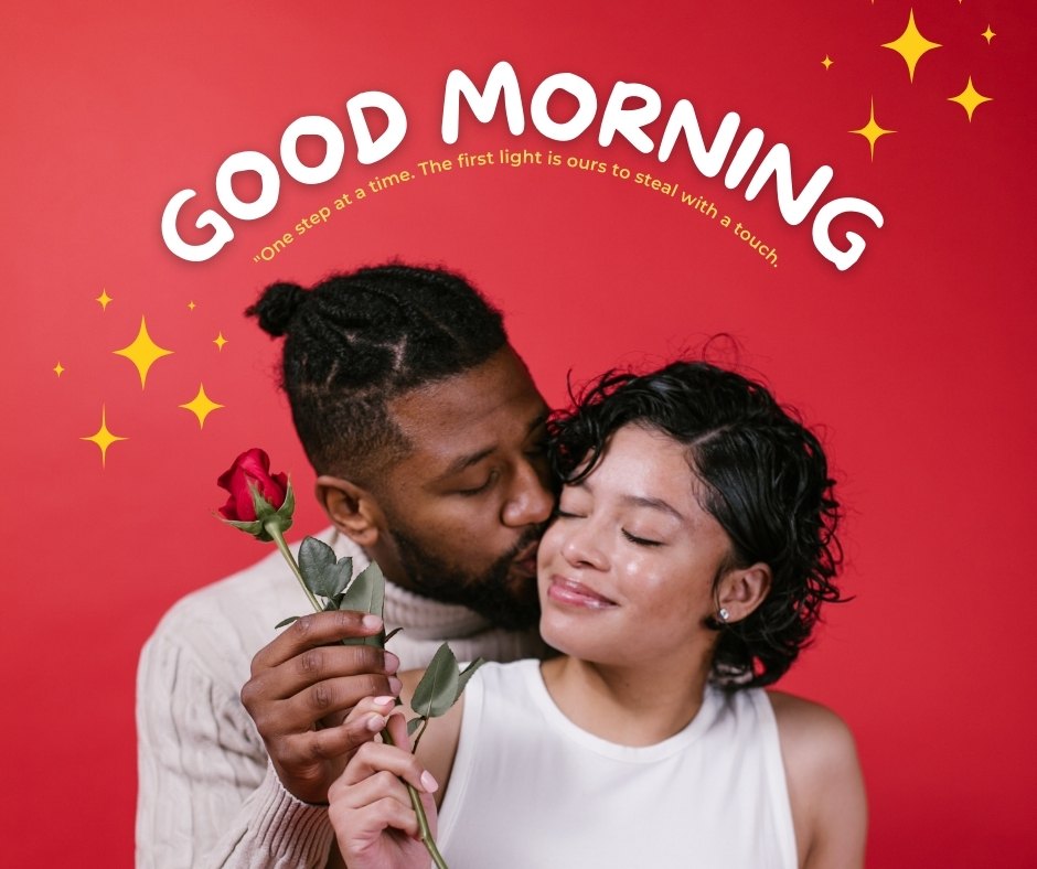 Intimate Good Morning Kiss Image featuring a man gently kissing his partner's forehead. The man, holding a single red rose, and his partner, smiling peacefully, are set against a vibrant red background adorned with stars and the caption 'Good Morning - one step at a time. The first light is ours to steal with a touch.'