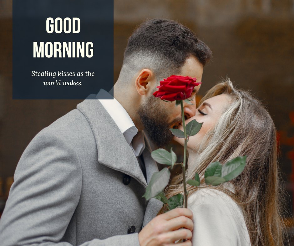 Elegant Good Morning Kiss Image capturing a romantic moment where a man in a grey suit gently kisses a woman, holding a red rose between them. Set against a blurred urban backdrop, the caption 'Good Morning - Stealing kisses as the world wakes.' enhances the mood of early morning romance.